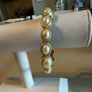 Chico’s Elegant Gold and Pearl Bracelet with magnetic closing.